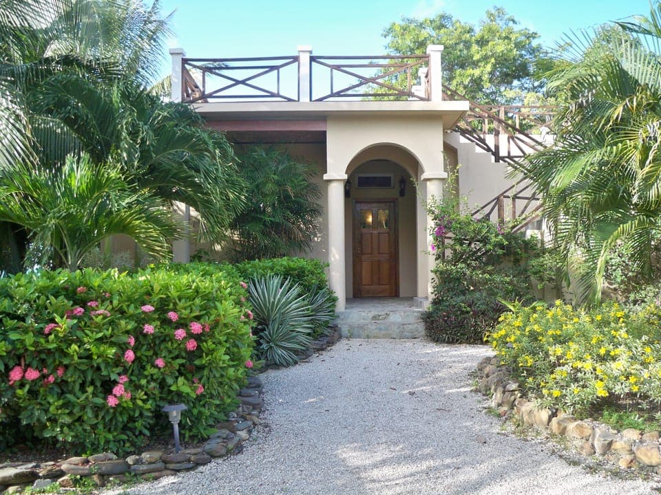 Lush landscaping delights the senses as you enter your vacation home!