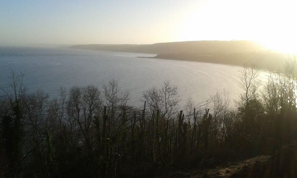 Have breakfast on the deck and watch the sun rise over the bay.
