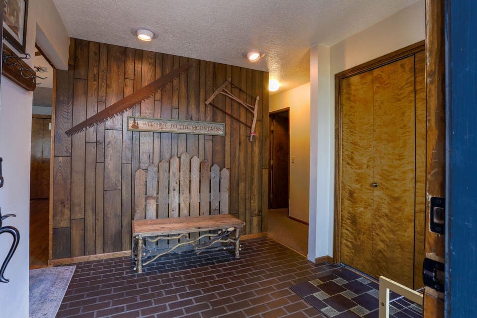 Large entry with coat closet and bench