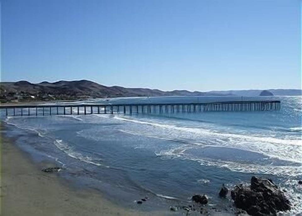 View of Cayucos Pier from condo deck.  Morro Rock can be seen in the background.