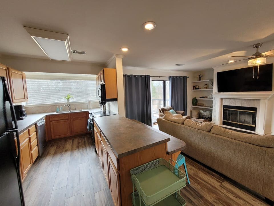 View of fully stocked kitchen and living space