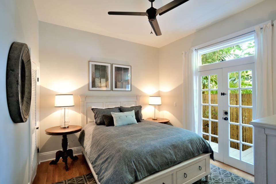 First floor bedroom with large french doors and access to back porch.