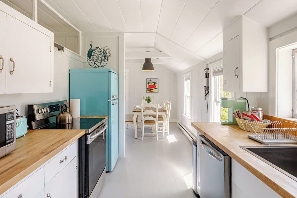 Kitchen w/ full size appliances + dinnerware, flatware, glassware, etc.