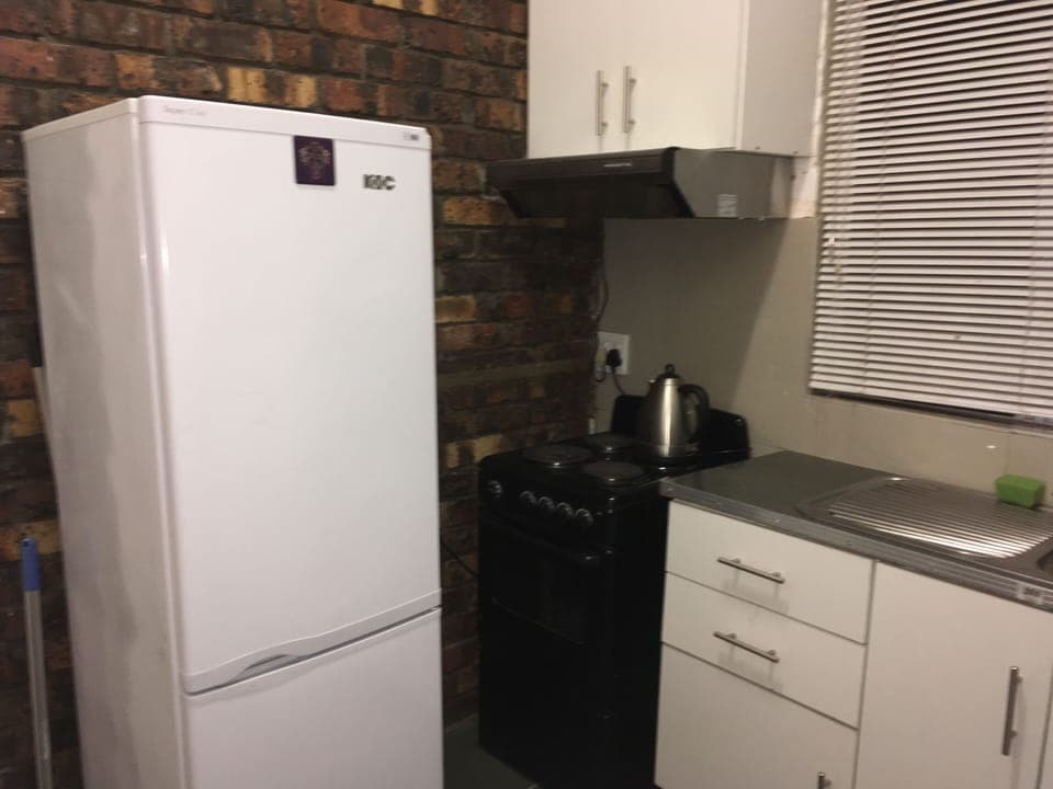 Kitchen: Fridge and stove