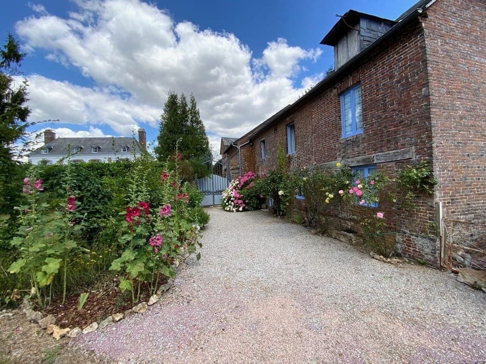 The Coach House - The Priory visible in the background 