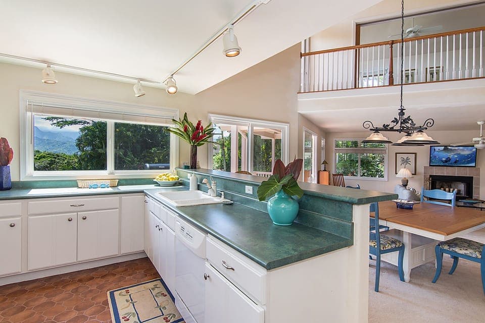 From kitchen, overseeing the great room while seeing Hanalei Bay and waterfalls.