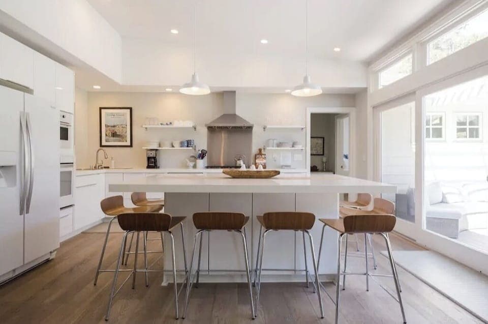 Kitchen with large glass doors to enter backyard and pool
