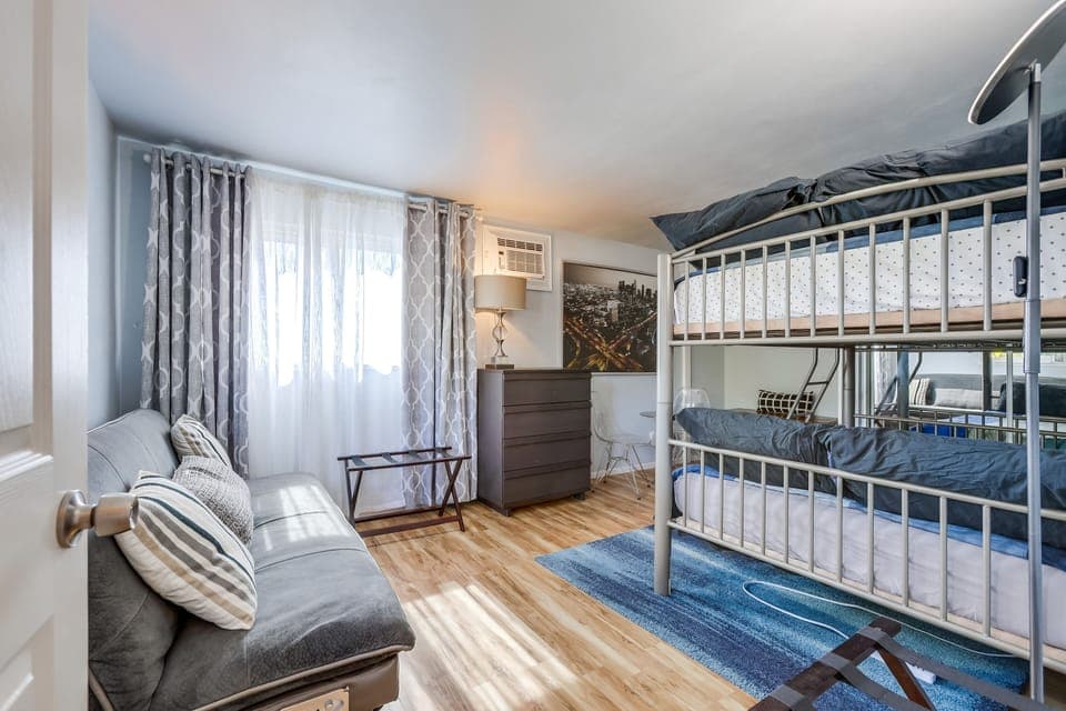 2 double wide beds, bunk style, with fold down couch if needed.  Extra Blankets!