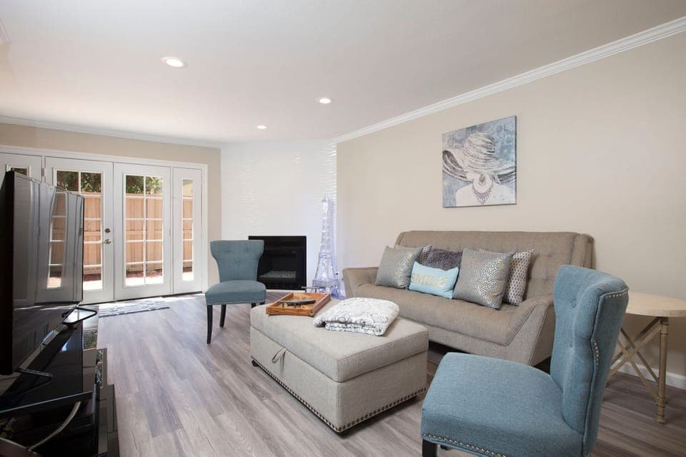 Living Space with Smart TV and comfortable Sofa and warm fireplace.