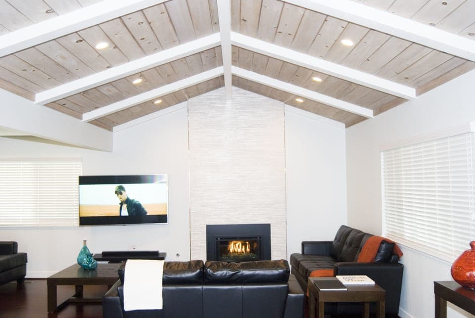 Living room with fireplace and 65" 4K SmartTV