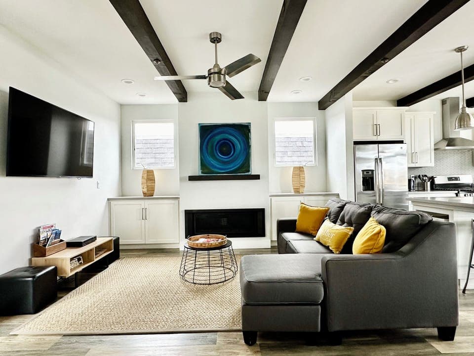 Living area with a gas fireplace and Sofa (Queen) Bed.