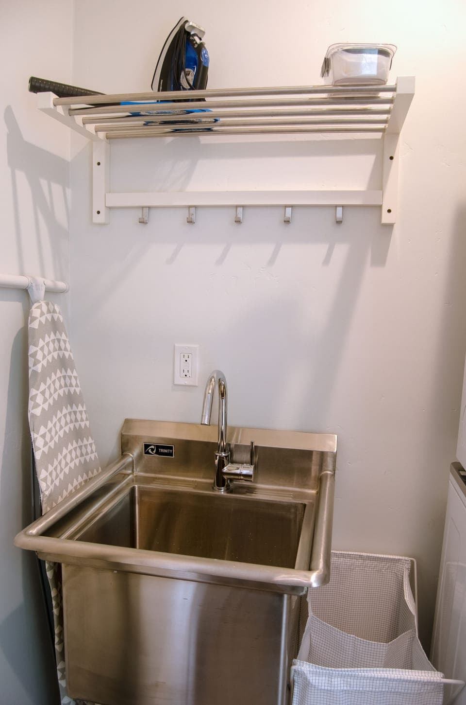 Utility sink located in laundry area. Iron and ironing board available. 