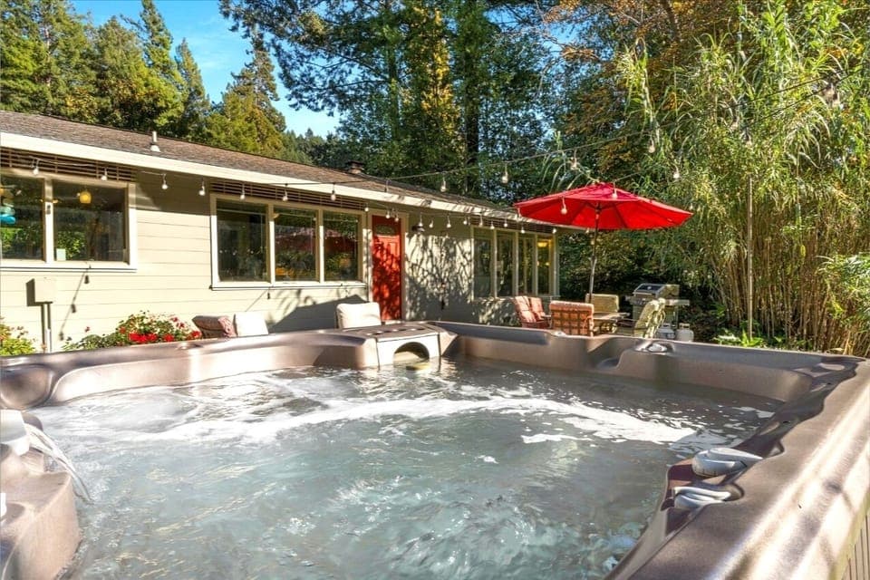 Enjoy the hot tub just steps away from the house