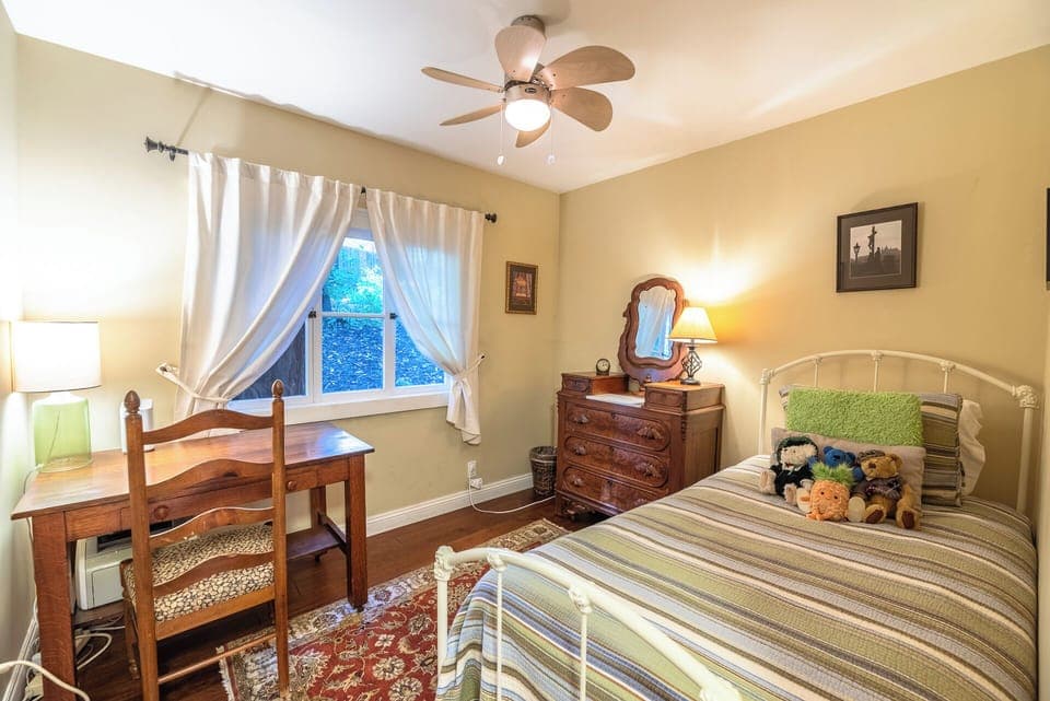 Bedroom 4 includes a twin bed and desk