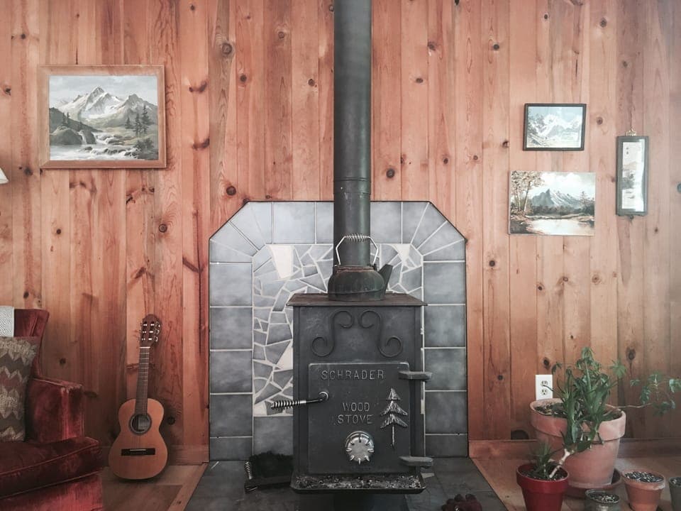 Cozy living room with wood stove.