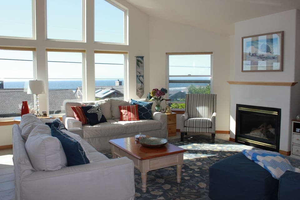 Cozy front room with fireplace and widescreen TV