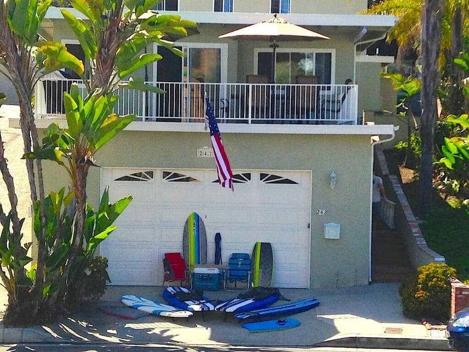 Front View w/ Beach Gear. Deck w/ Patio Set and BBQ Above Garage.