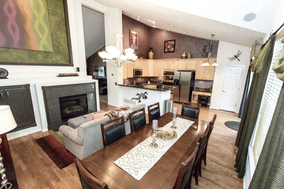 Yes! A fireplace and couch in the dining room. Table seats 8.
