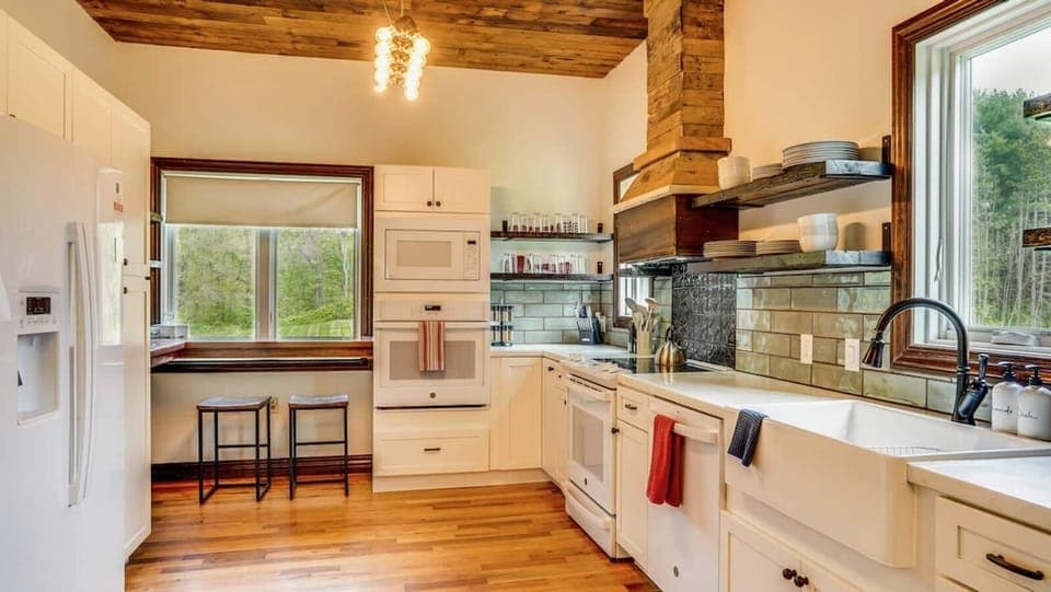 Kitchen- Newly renovated with new appliances, double ovens, and now an open flow to living area. Included is coffee/tea bar, insta-pot, crock pot, gridle, blender, and just about anything you might need for your group.  Just ask, we probably have it!