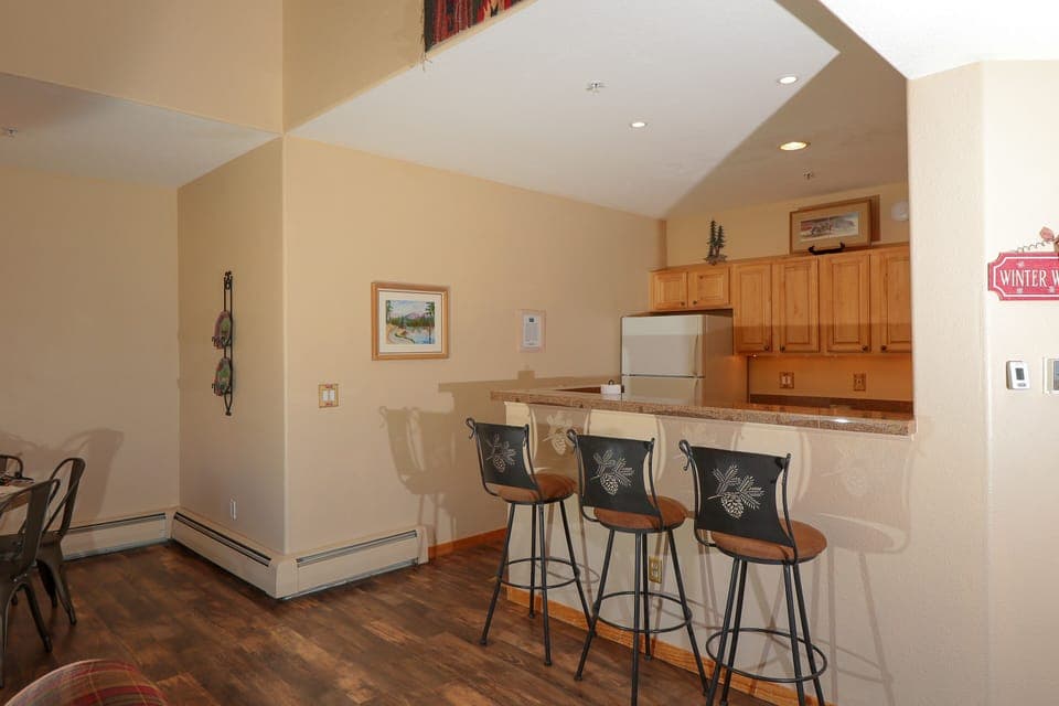 Breakfast bar with three stools.
