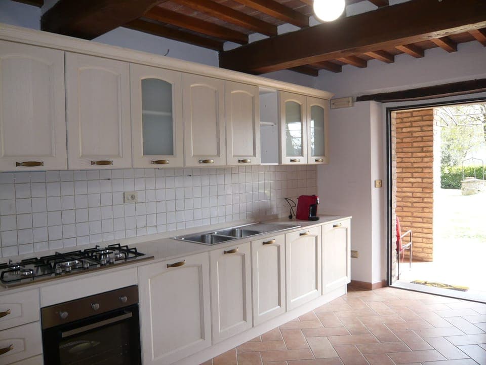 Renovated kitchen overlooking the porch and garden