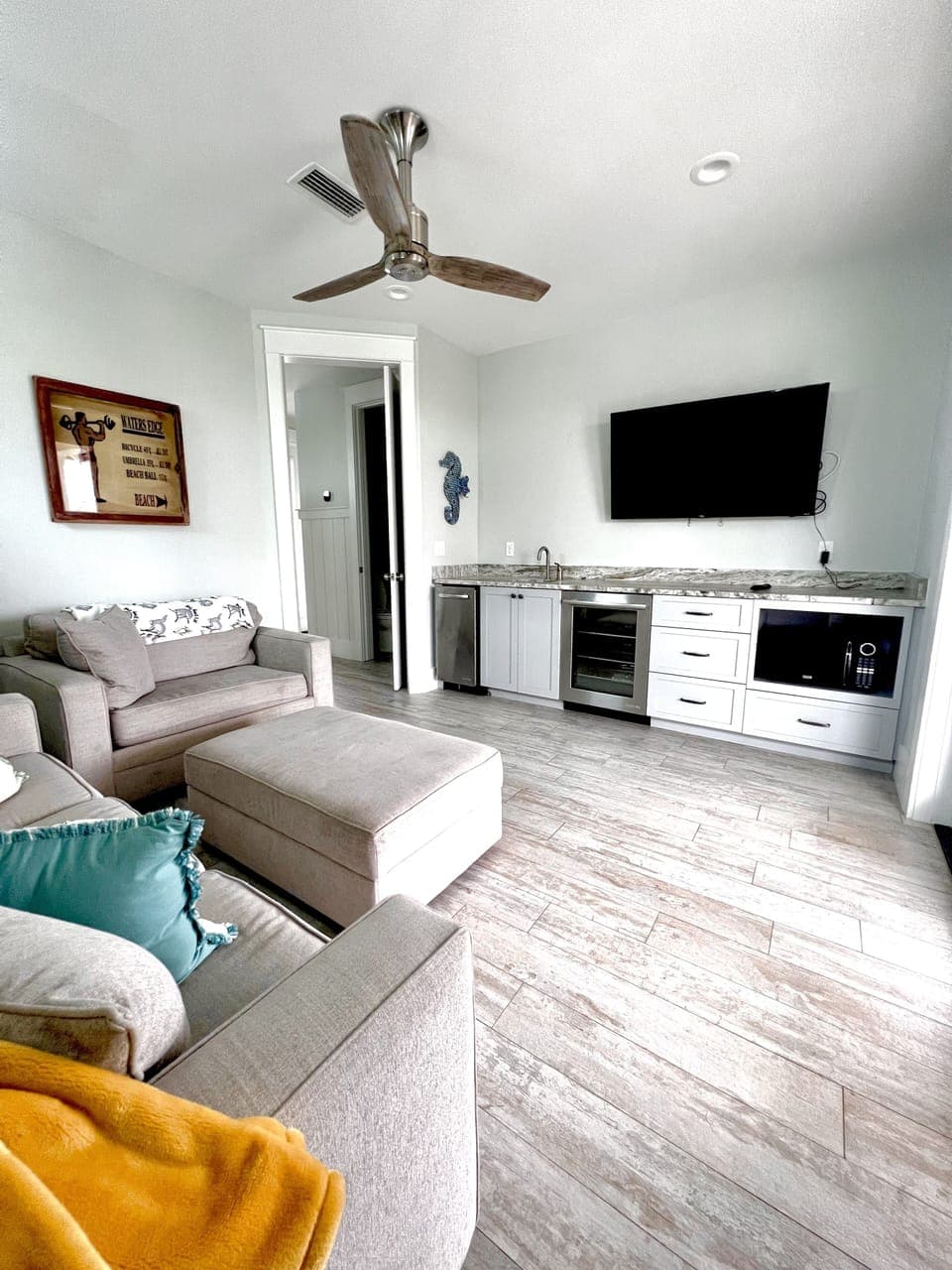 Third floor media room with ice maker & beverage fridge. Awesome decks too!