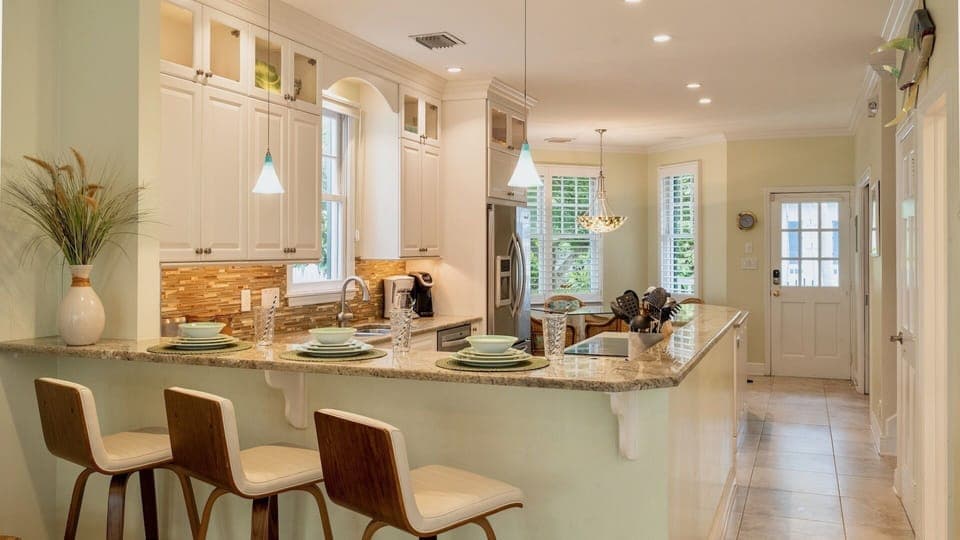 The kitchen bar is perfect for a quick bite or keeping the chef company...