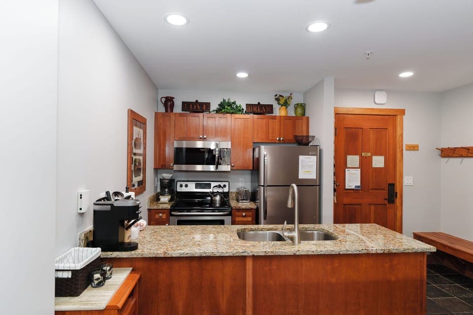 Your fully equipped kitchen features granite countertops, stainless steel appliances, and everything you need to prepare meals during your stay.