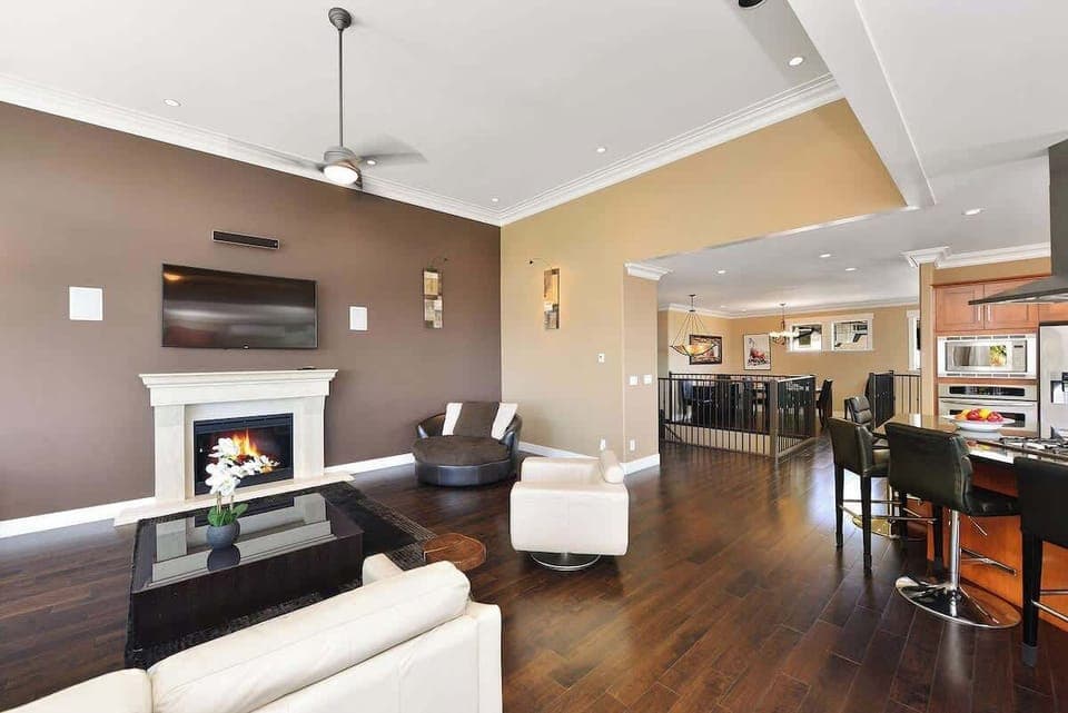 Upper main level living, kitchen, and dining space. 