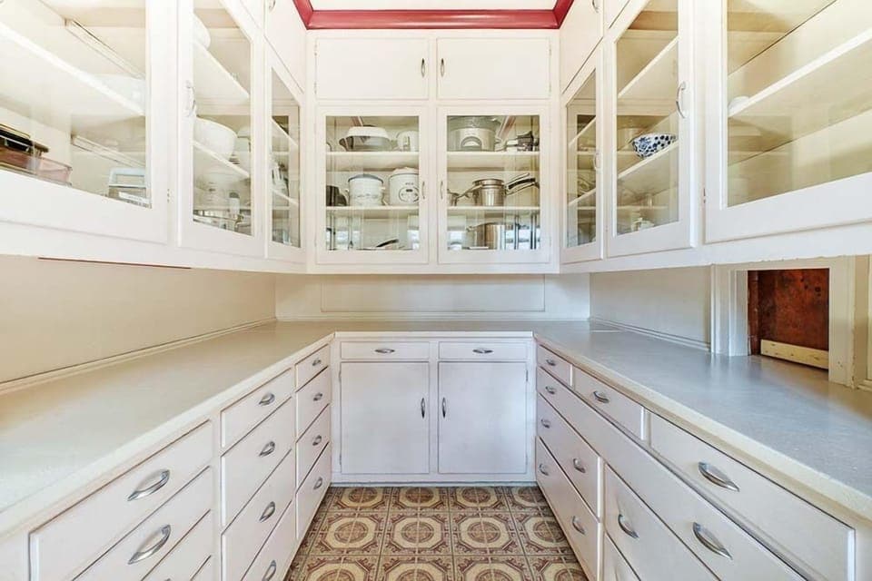 The Pantry is Fully-Stocked with everything from pots and pans to a crock pot and extra dishes.