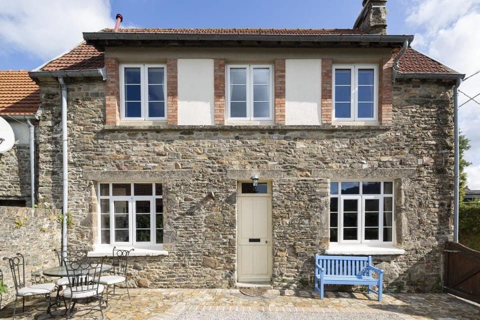 Front of Glatigny Farmhouse, south face walled garden with large bbq and pit.