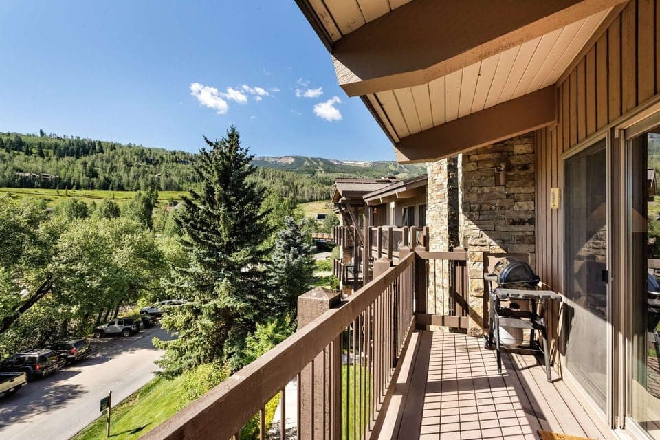 A gas grill on the balcony makes grilling easy.  The charlift can be seen in the background, right across the bridge.