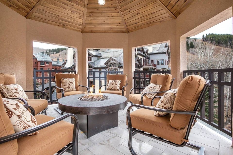 Gazebo covered deck with plush seating and natural gas fire pit.