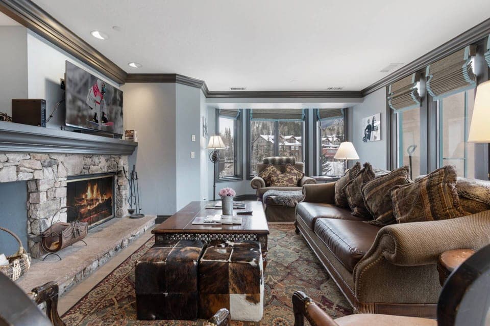 Spacious Living Room with Wood Burning Fireplace and Views of Beaver Creek Slopes