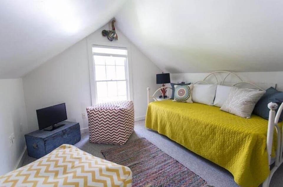 Light filled second story room with daybed