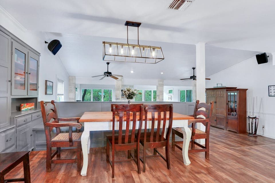 View of the dining area as you walk out from the laundry room moving toward the living room.