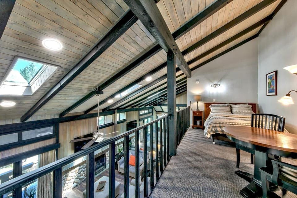 The upstairs loft is open to the living room and doubles as an extra bedroom