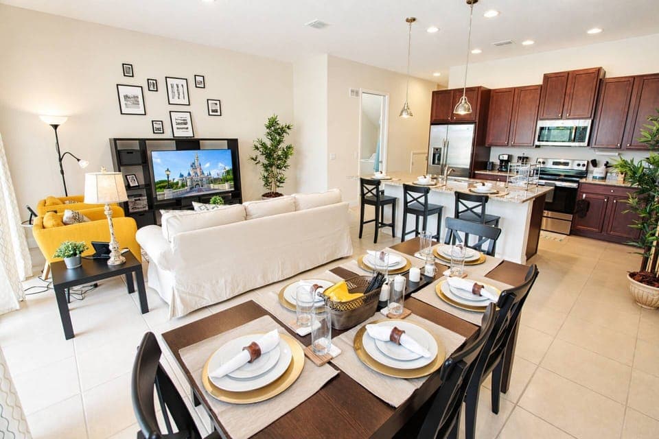 Open Dining/Living/Kitchen with access to the patio. Dining seating for 6 at the table and 3 at the bar