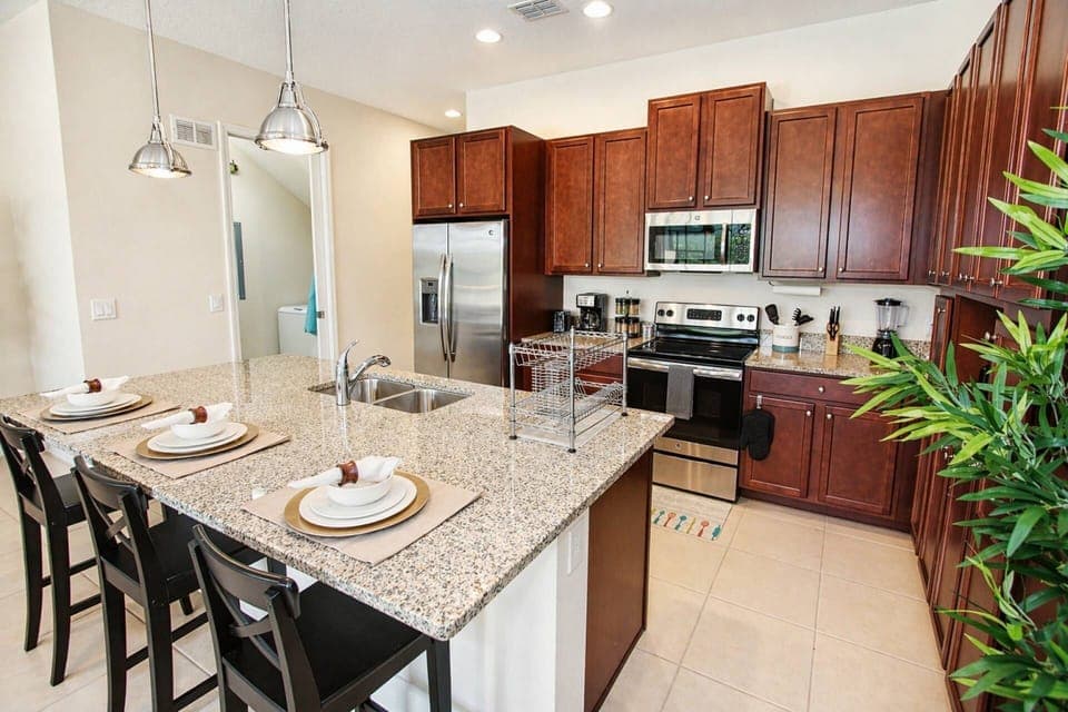Modern Fully Equipped Kitchen with Stainless Steel appliances and granite counters