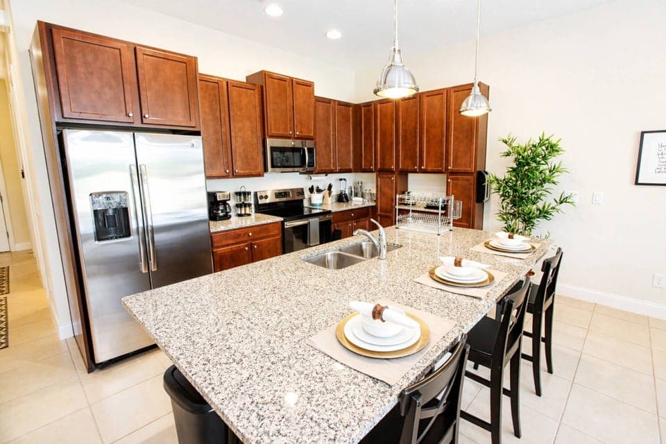 Bright and open kitchen with stainless steel appliances and Granite counters