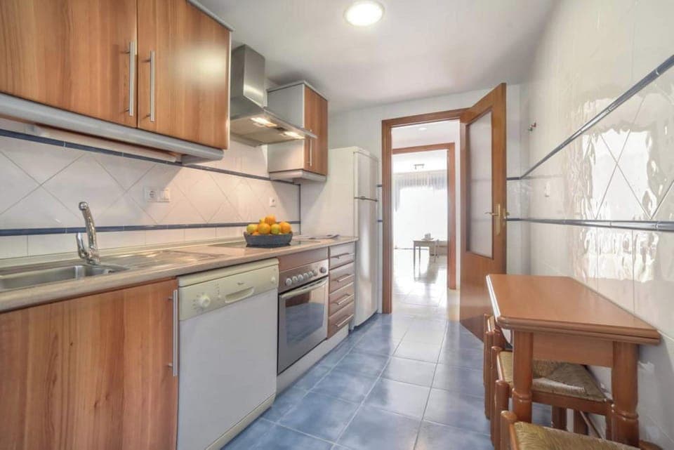 We are pleased to present you our beautiful holiday apartment with communal pool in Calpe, Costa Blanca. This apartment sleeps 4 people and has two bedrooms and two bathrooms.Inside the apartment, you will find a spacious living-dining room with TDT/SAT TV, air conditioning and access to the terrace. The kitchen is independent and fully equipped with a ceramic hob and dishwasher. The two bedrooms have a double bed each and also have air conditioning. One of the bedrooms has an en-suite bathroom with a bathtub. In addition, there is another bathroom with a shower.Outside, the apartment offers a pleasant area with a communal pool, Roman steps and outdoor shower, perfect for cooling off on hot summer days. There is also a tennis court available to guests, as well as a parking space for one vehicle.The location of the apartment is privileged, since it is close to the sea and all services. The nearest rock cove is just 750 meters away, and the restaurants and center of Calpe are 900 meters away. Furthermore, the nearest supermarket is just 350 meters from the apartment.Importantly, we offer free WiFi so you can stay connected during your stay. In addition, pets up to 12 kg are allowed with an additional fee.We hope you enjoy your stay in our beautiful holiday apartment with communal pool in Calpe. If you have any additional questions or need more information, do not hesitate to contact us.