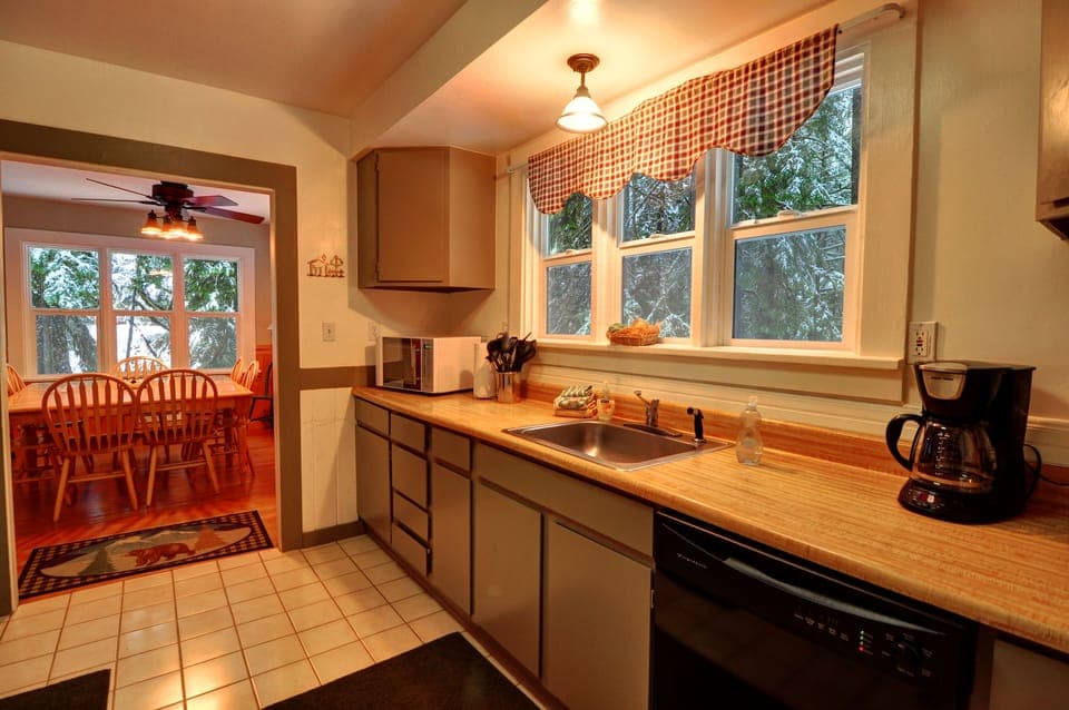 Kitchen - kitchen complete with dishwasher, refrigerator, coffee maker, microwave, and washer and dryer.