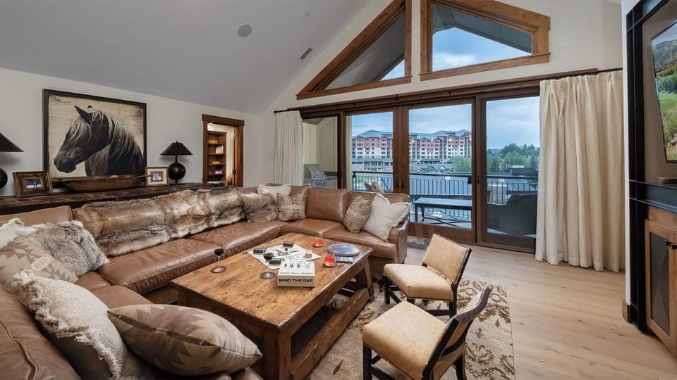 Great Room, Main Level - With vaulted ceiling and deck views
