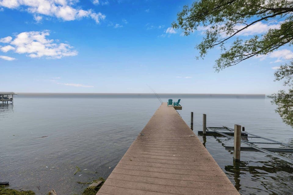 Seneca Lake waterfront home with dock and scenic sunset views