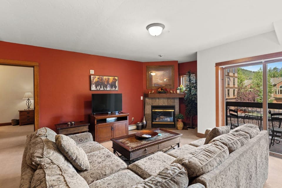 Living area with flat screen TV and fireplace