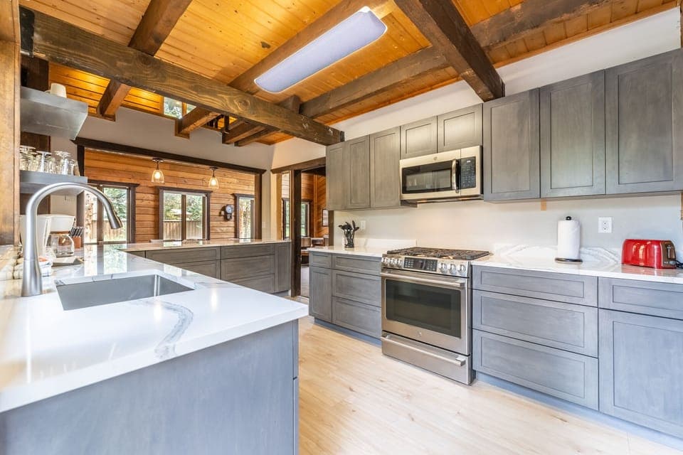 Updated full size kitchen with granite countertops, hardwood flooring and new stainless steel appliances throughout.