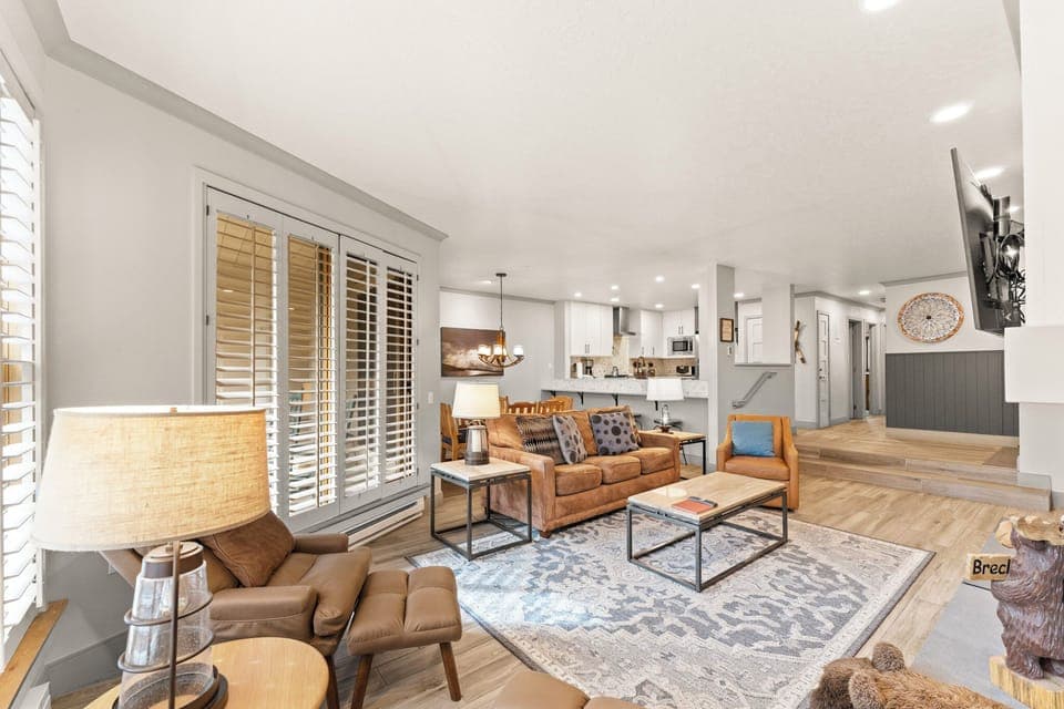 Living area with cozy seating, flat screen TV, and fireplace