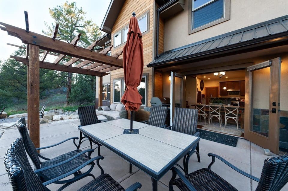 Outdoor living space - Dining Table, BBQ, couch and gas fire pit