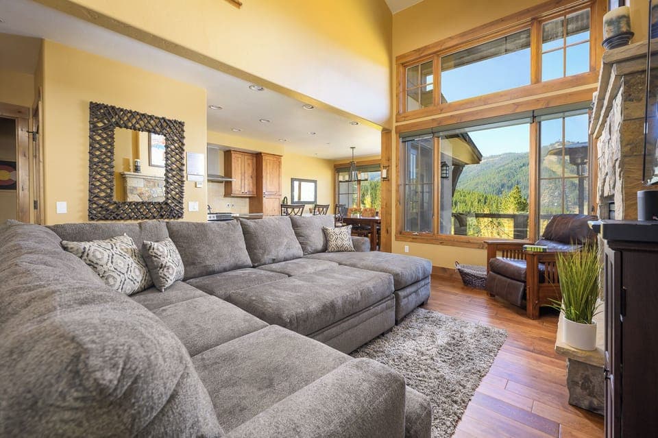 The open living room leads into the kitchen & dining room
