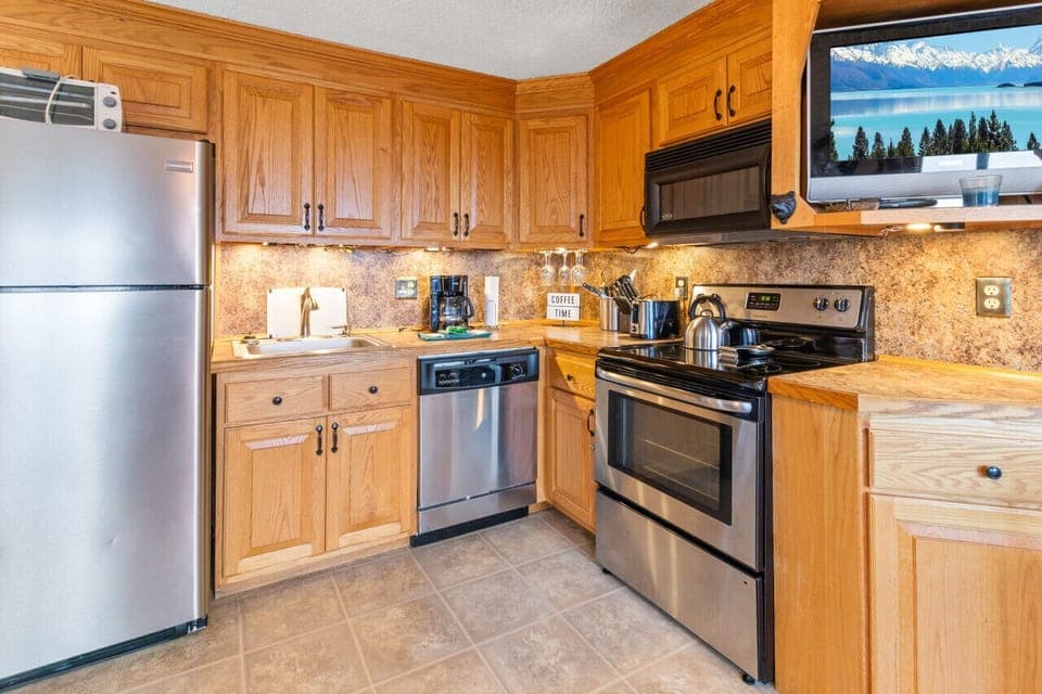 Remodeled kitchen is fully-equipped with pots, pans & utensils